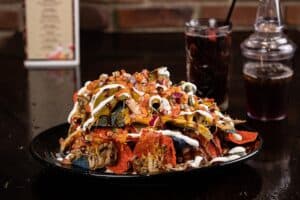 Welded Nachos with BBQ pulled pork baked in brick oven