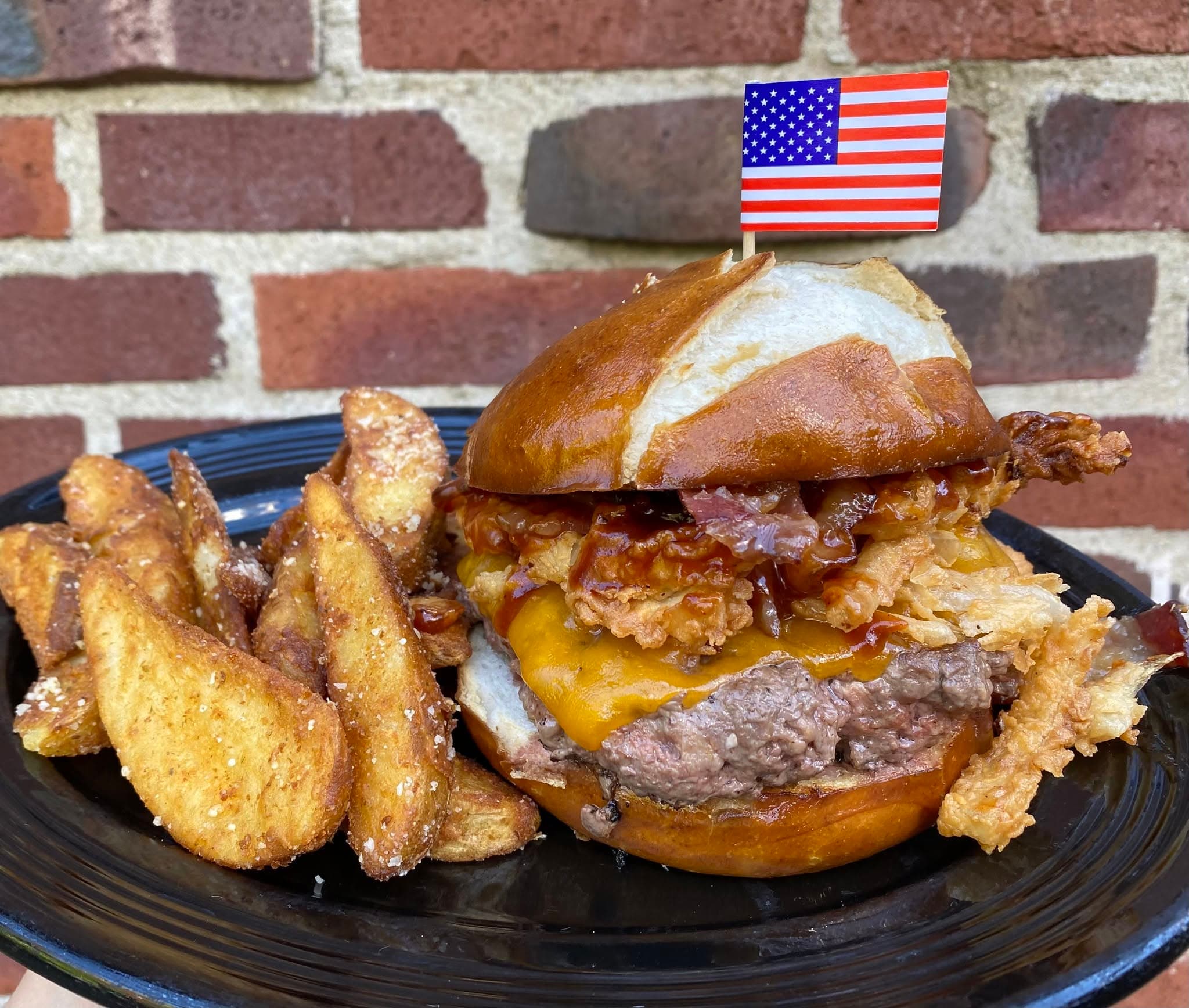 Crispy fried chicken sandwich with caramelized onions