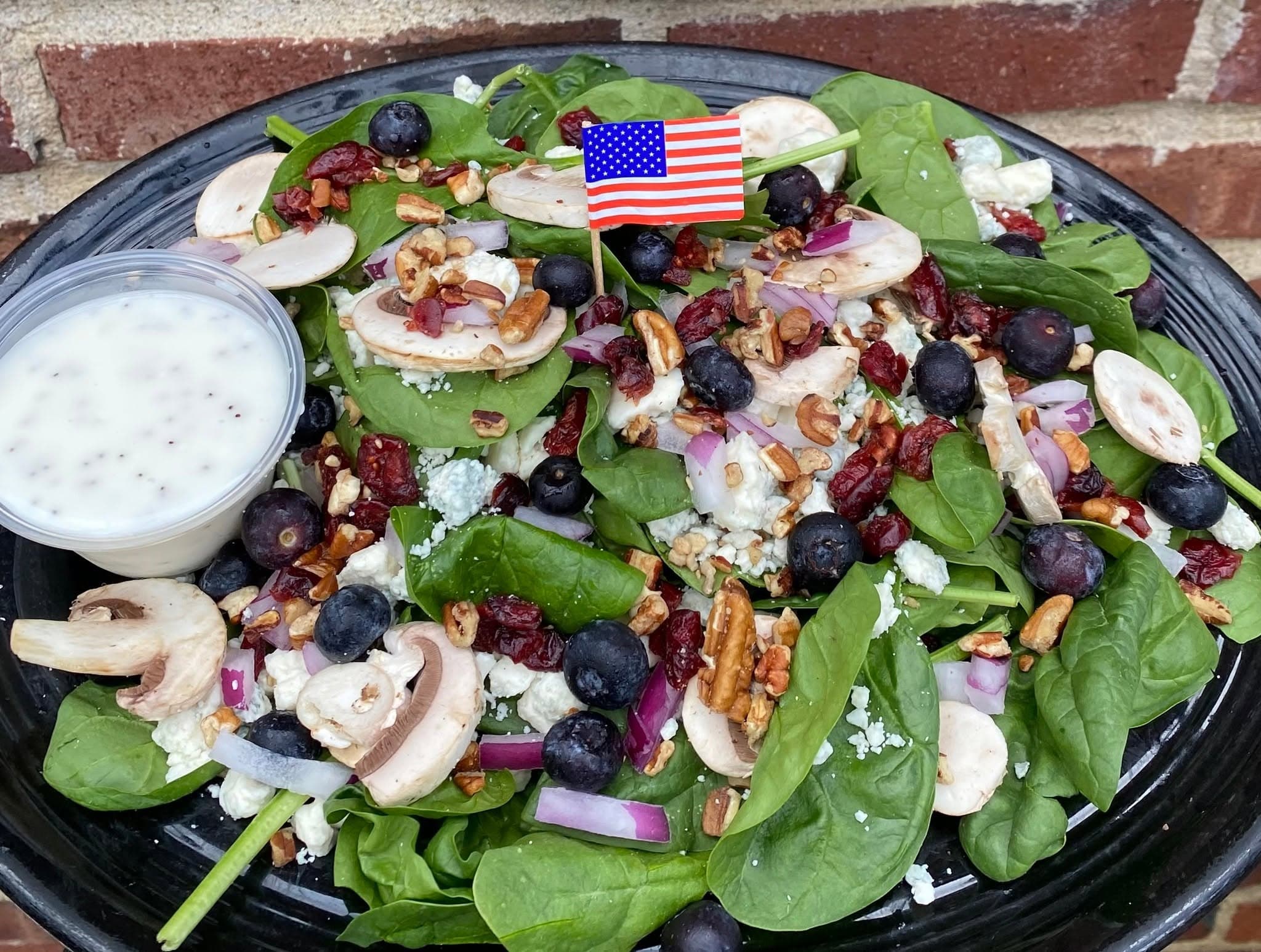 Spinach salad with shrimp, mushrooms, and feta